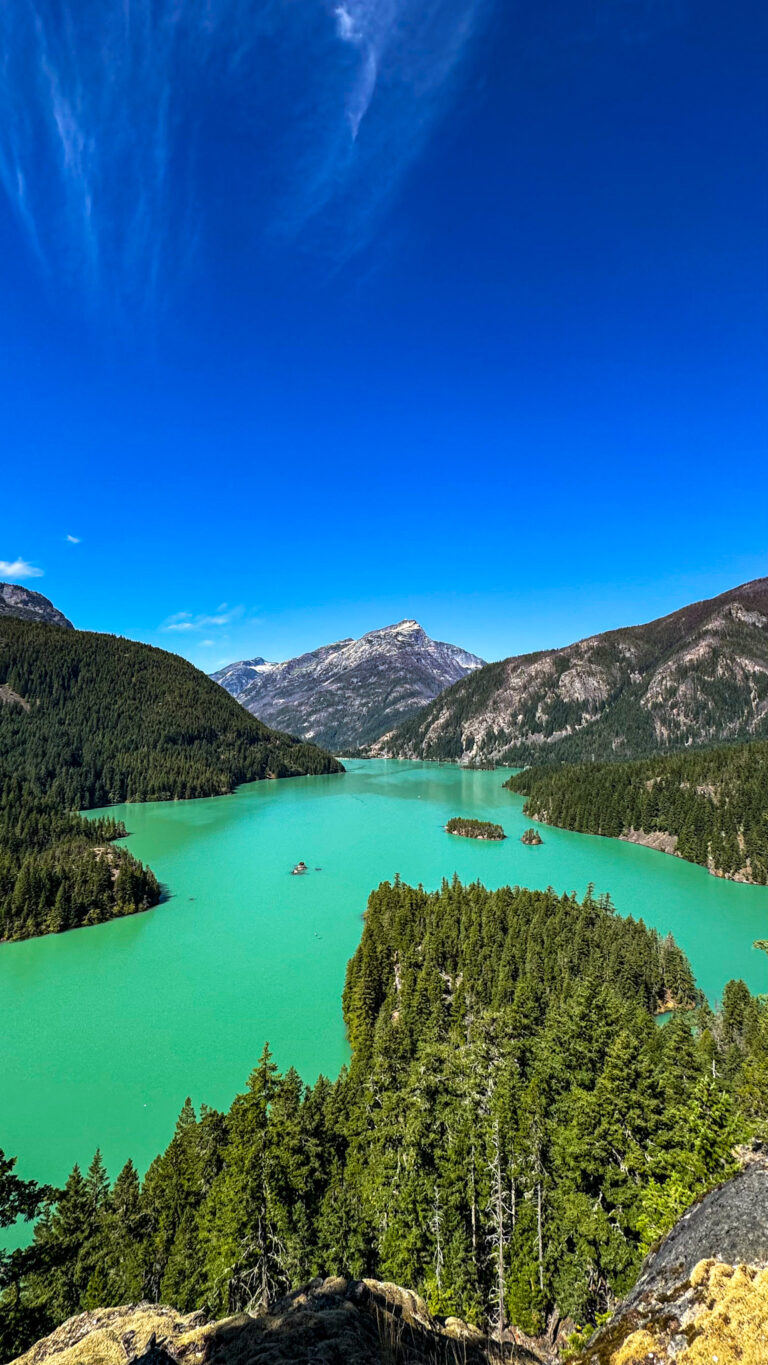 Turquoise Diablo Lake surrounded by forested mountains in North Cascades National Park, Washington.