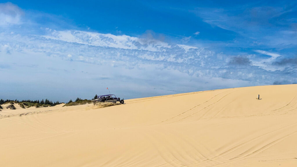 ATV riding across sand dunes at the Oregon Dunes National Recreation Area on the Oregon Coast.