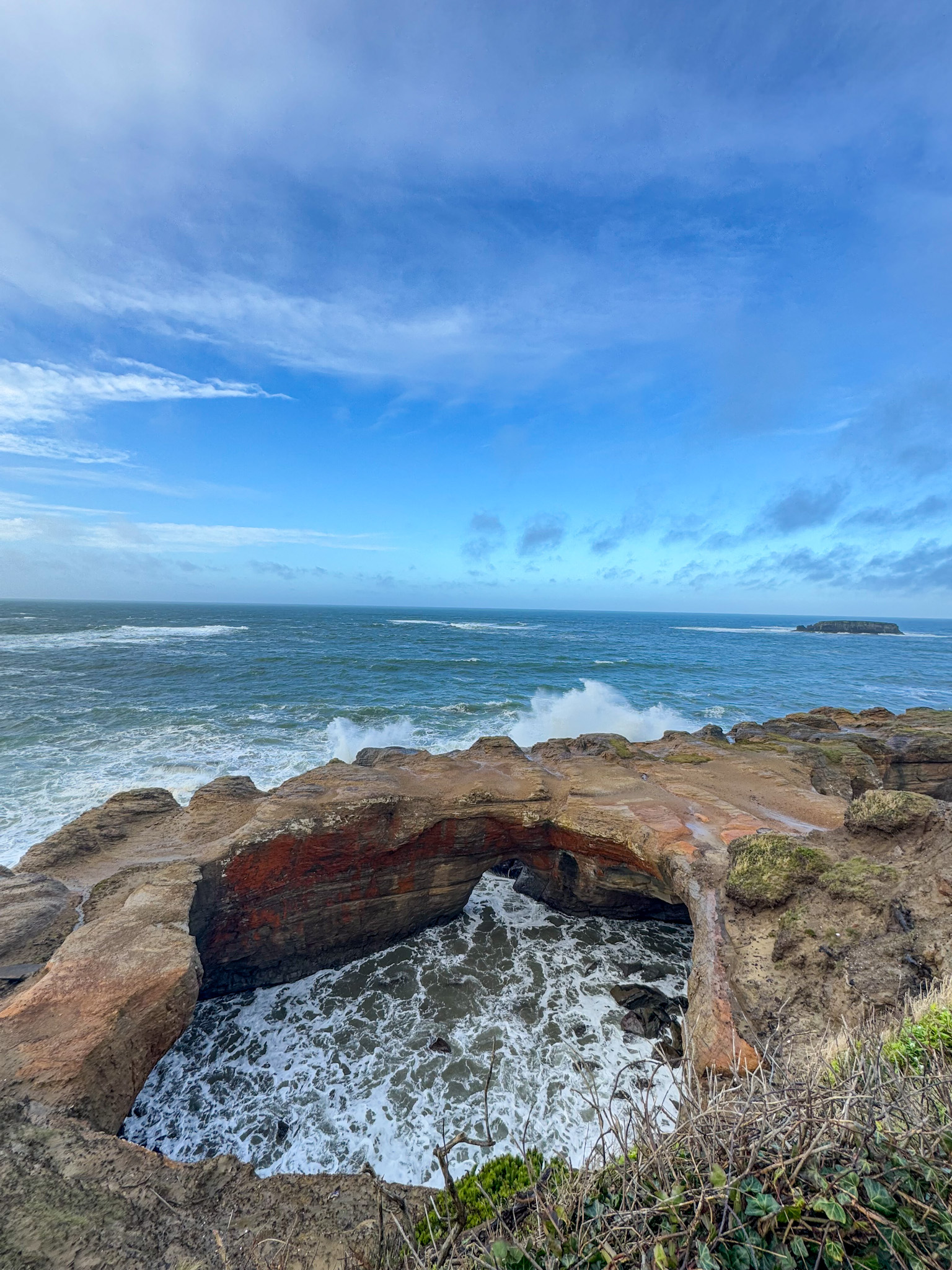 Natural rock arch at Devil’s Punchbowl State Natural Area on the Oregon Coast.
