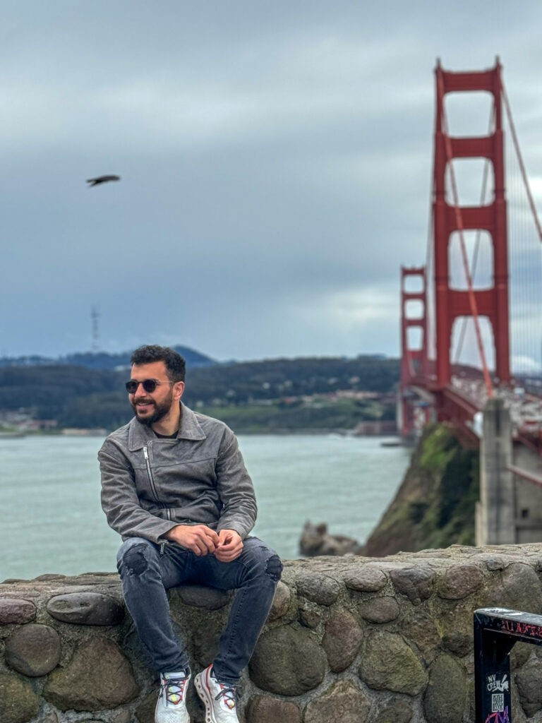 Sitting near the Golden Gate Bridge viewpoint in San Francisco on a cloudy day.