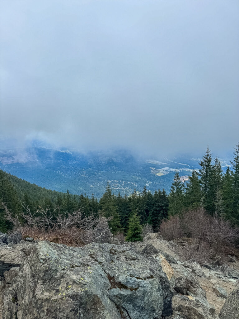 Foggy summit overlook from Mount Si trail in Washington State.