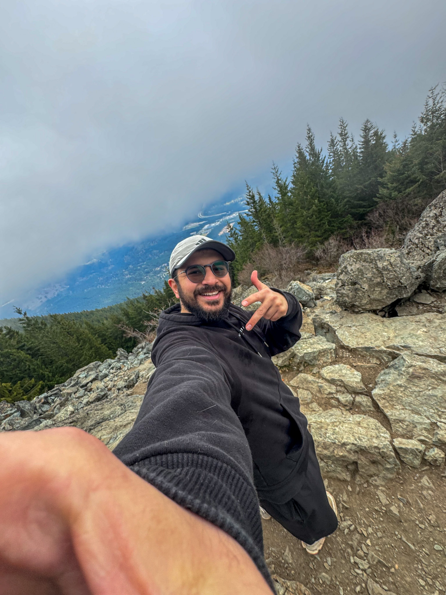 Traveler taking selfie near the summit of Mount Si in Washington State.