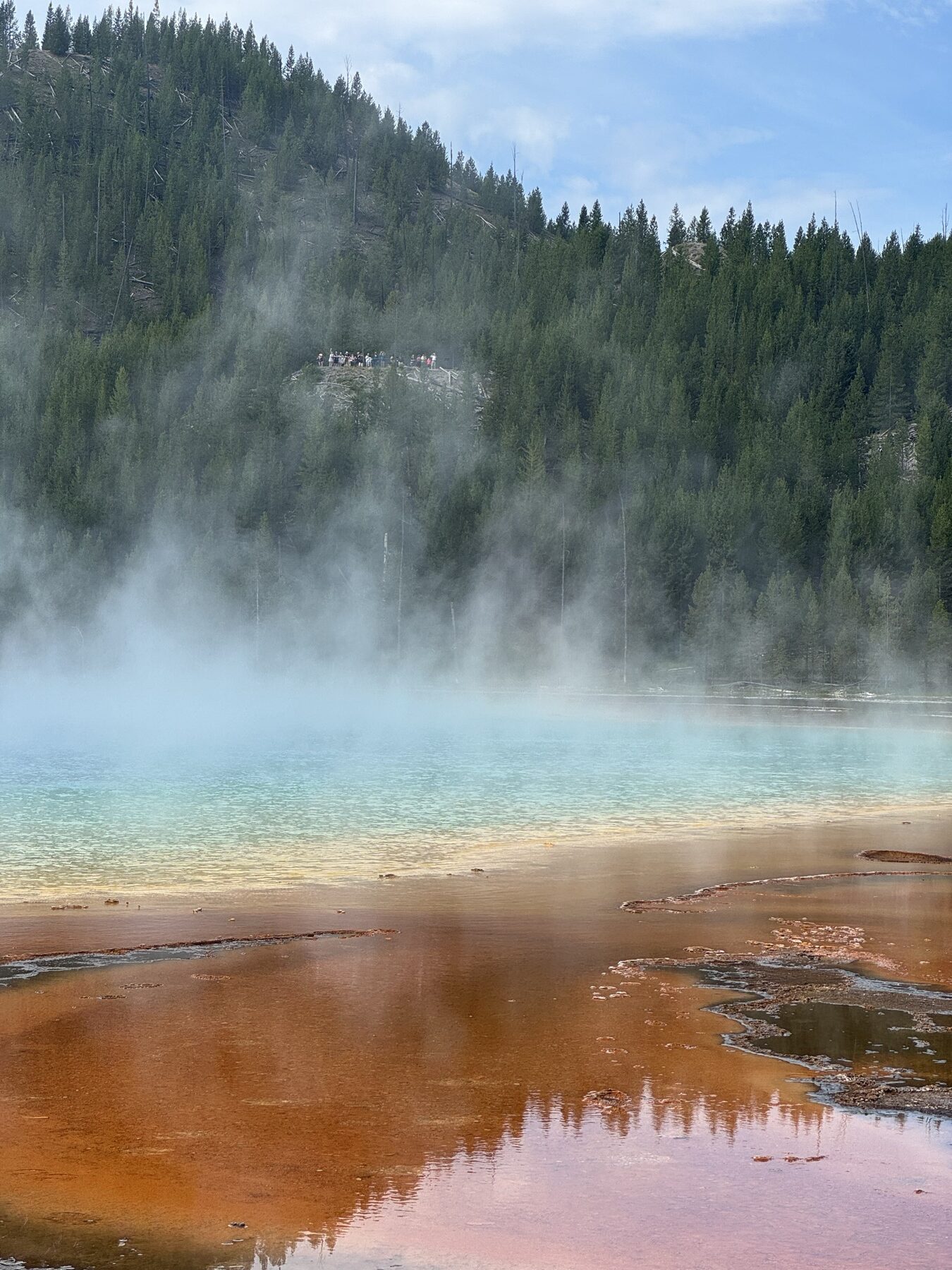 Grand Prismatic Spring with visitors visible across the thermal basin